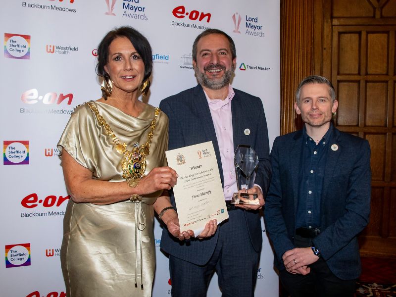 Firas Sharefy being presented an award